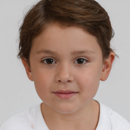 Joyful white child male with short  brown hair and brown eyes