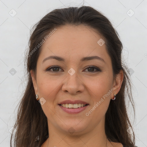 Joyful white young-adult female with long  brown hair and brown eyes