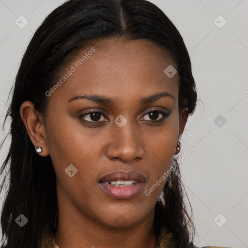 Joyful black young-adult female with long  brown hair and brown eyes