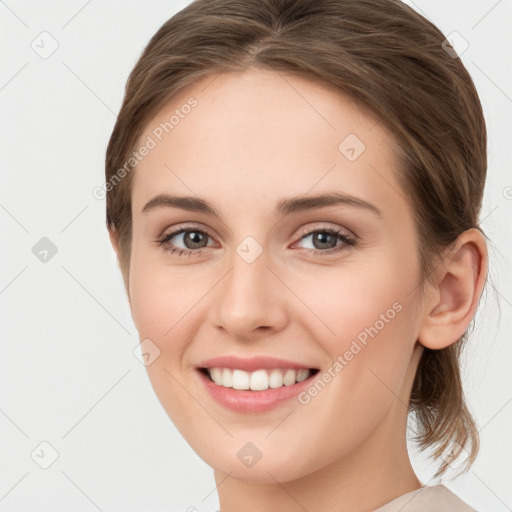 Joyful white young-adult female with medium  brown hair and green eyes