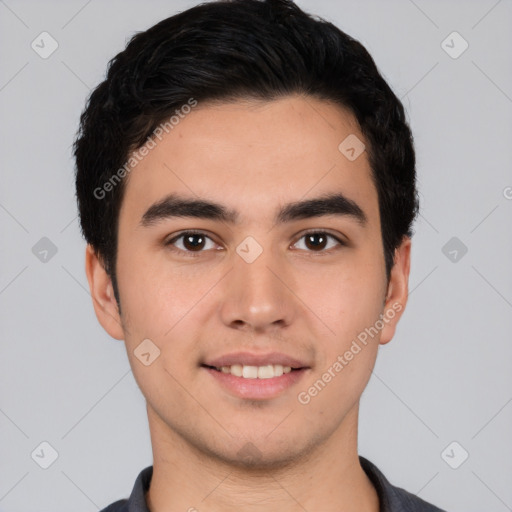 Joyful white young-adult male with short  black hair and brown eyes