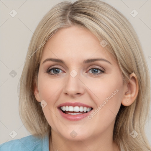 Joyful white young-adult female with medium  brown hair and blue eyes