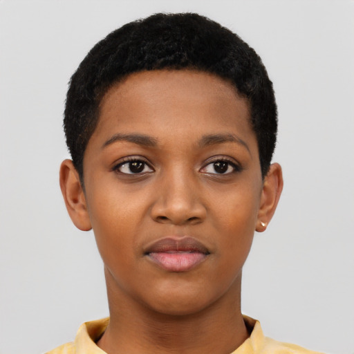 Joyful black young-adult female with short  black hair and brown eyes