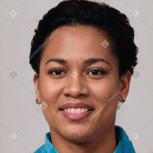 Joyful latino young-adult female with short  black hair and brown eyes