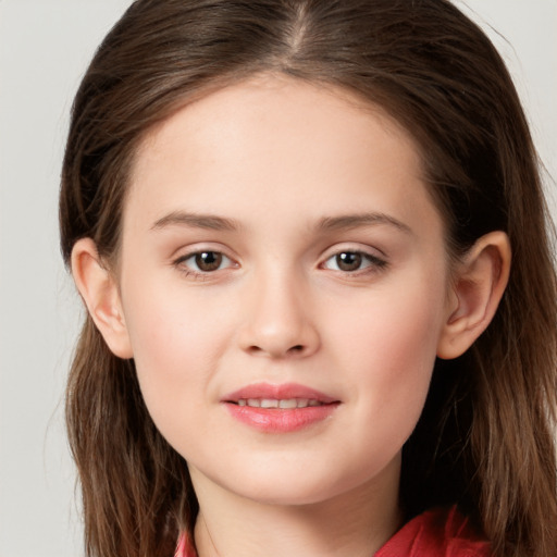 Joyful white child female with long  brown hair and brown eyes