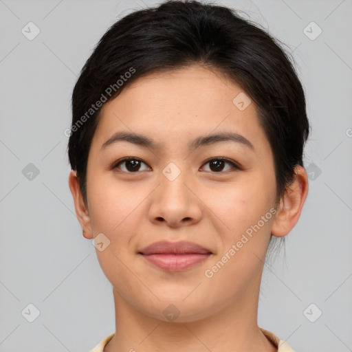 Joyful asian young-adult female with short  brown hair and brown eyes