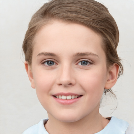 Joyful white child female with short  brown hair and grey eyes