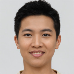 Joyful asian young-adult male with short  black hair and brown eyes