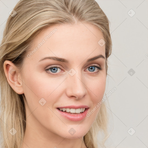 Joyful white young-adult female with long  brown hair and blue eyes