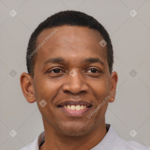 Joyful black young-adult male with short  black hair and brown eyes