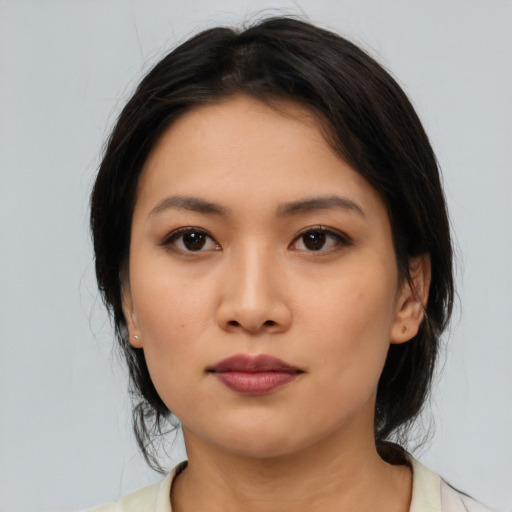 Neutral asian young-adult female with medium  black hair and brown eyes