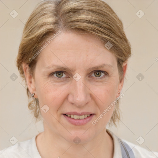 Joyful white adult female with medium  brown hair and blue eyes