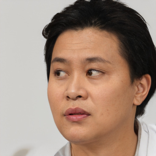 Neutral asian young-adult female with short  black hair and brown eyes