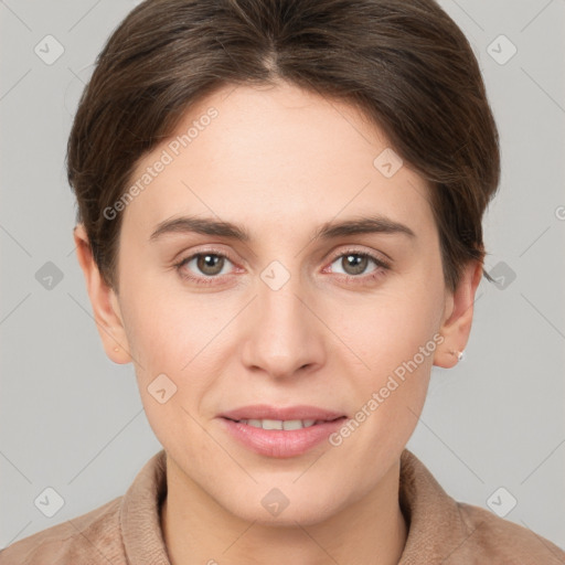 Joyful white young-adult female with short  brown hair and grey eyes