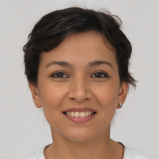 Joyful asian young-adult female with short  brown hair and brown eyes