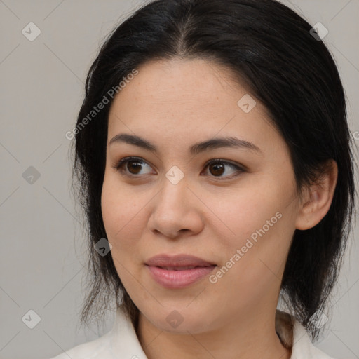 Joyful latino young-adult female with medium  brown hair and brown eyes