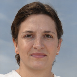 Joyful white adult female with short  brown hair and brown eyes