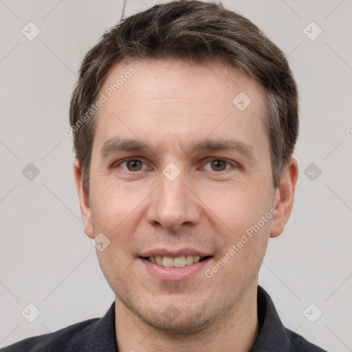 Joyful white adult male with short  brown hair and brown eyes