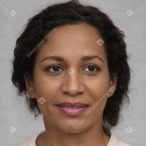 Joyful latino adult female with medium  brown hair and brown eyes