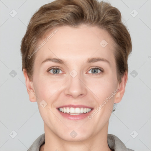 Joyful white young-adult female with short  brown hair and grey eyes