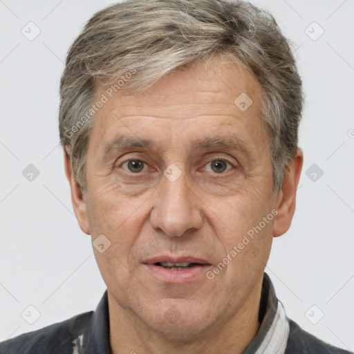 Joyful white middle-aged male with short  brown hair and brown eyes