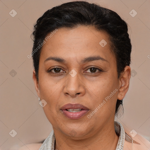 Joyful latino adult female with short  brown hair and brown eyes