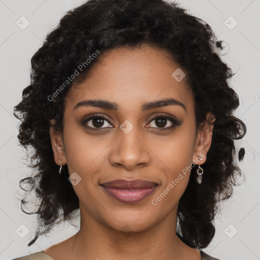 Joyful black young-adult female with long  brown hair and brown eyes