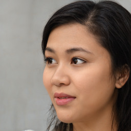 Joyful asian young-adult female with medium  black hair and brown eyes