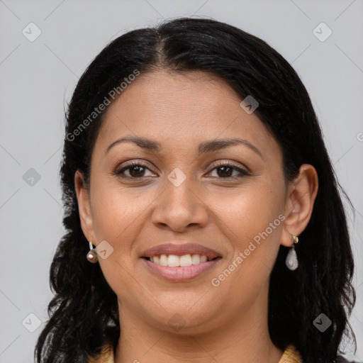 Joyful latino young-adult female with long  brown hair and brown eyes