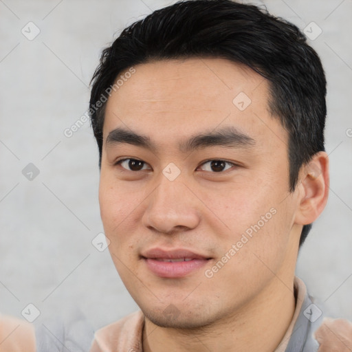 Joyful asian young-adult male with short  black hair and brown eyes