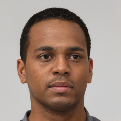 Neutral black young-adult male with short  brown hair and brown eyes