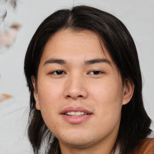Joyful asian young-adult male with medium  brown hair and brown eyes