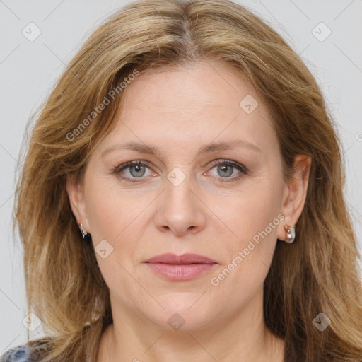 Joyful white adult female with long  brown hair and brown eyes