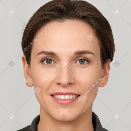 Joyful white young-adult female with short  brown hair and grey eyes