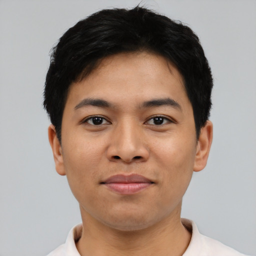 Joyful asian young-adult male with short  black hair and brown eyes