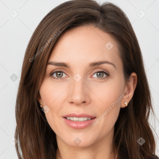 Joyful white young-adult female with long  brown hair and brown eyes