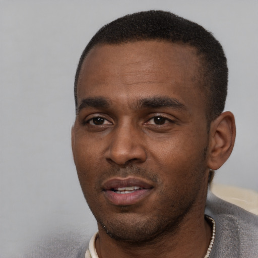 Neutral black young-adult male with short  black hair and brown eyes