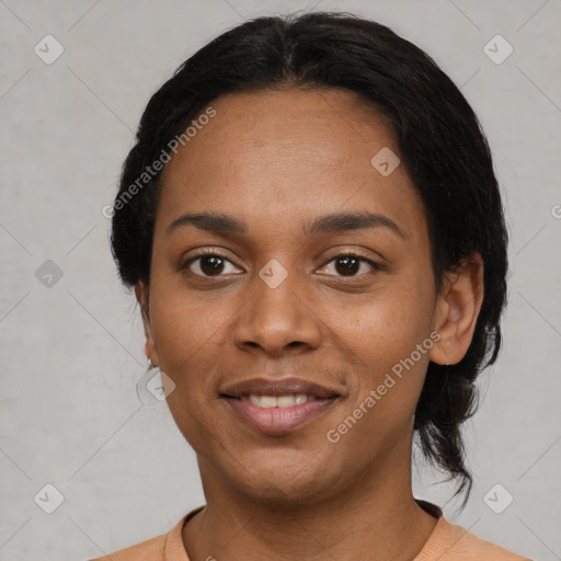 Joyful black young-adult female with medium  black hair and brown eyes