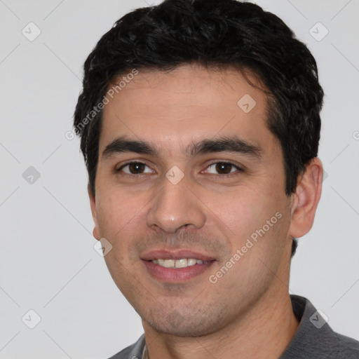 Joyful white young-adult male with short  black hair and brown eyes