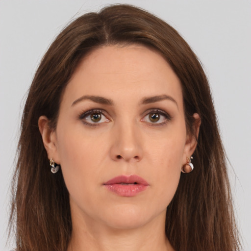 Neutral white young-adult female with long  brown hair and brown eyes