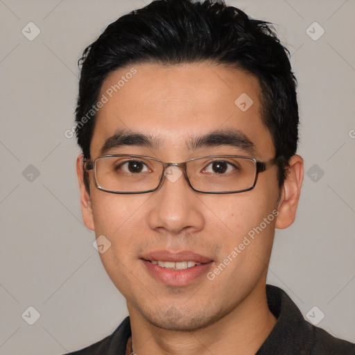 Joyful white young-adult male with short  black hair and brown eyes