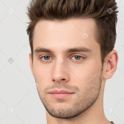 Neutral white young-adult male with short  brown hair and brown eyes