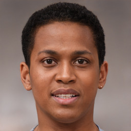 Joyful black young-adult male with short  brown hair and brown eyes