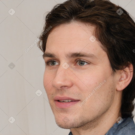 Joyful white adult male with short  brown hair and grey eyes