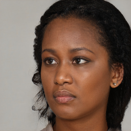 Neutral black young-adult female with long  black hair and brown eyes