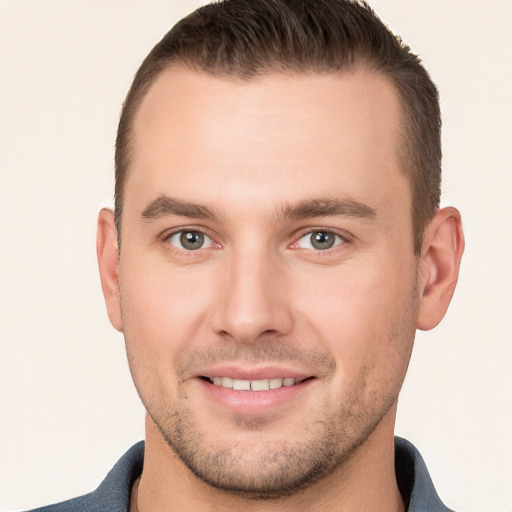 Joyful white young-adult male with short  brown hair and brown eyes