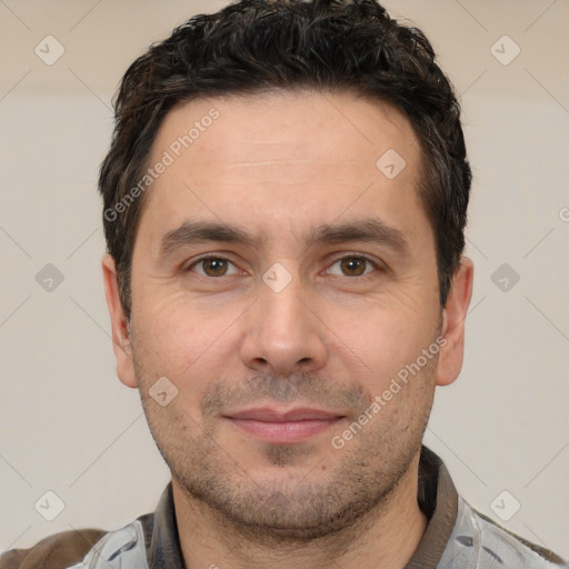 Joyful white adult male with short  brown hair and brown eyes