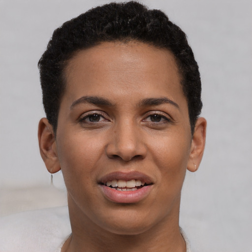 Joyful latino young-adult female with short  brown hair and brown eyes