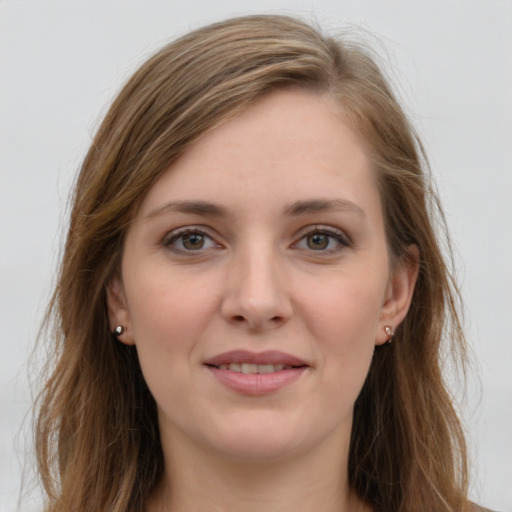 Joyful white young-adult female with long  brown hair and grey eyes