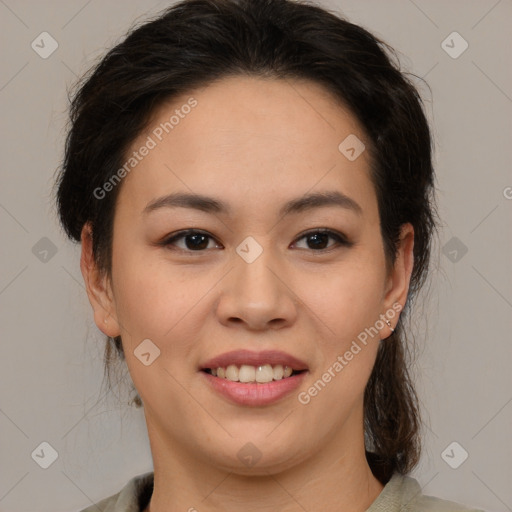 Joyful latino young-adult female with medium  brown hair and brown eyes